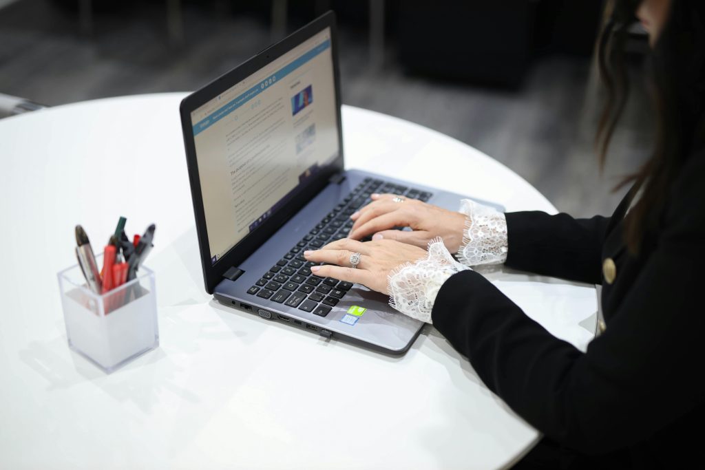 pexels-donna-bulika-1944997-3568689 An employee typing on a laptop